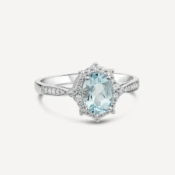 9ct White Gold 0.19ct Oval Aquamarine & Diamond Star Halo Ring