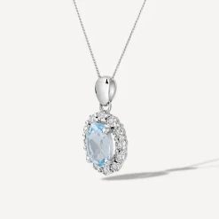 9ct White Gold Oval Blue Topaz 0.05ct Diamond Cluster Pendant