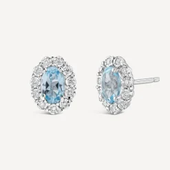 9ct White Gold Oval Blue Topaz Centre 0.05ct Diamond Cluster Stud Earrings