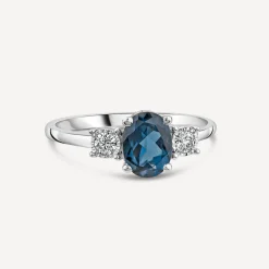 9ct White Gold Oval Blue Topaz & 0.15ct Diamond Sides Ring