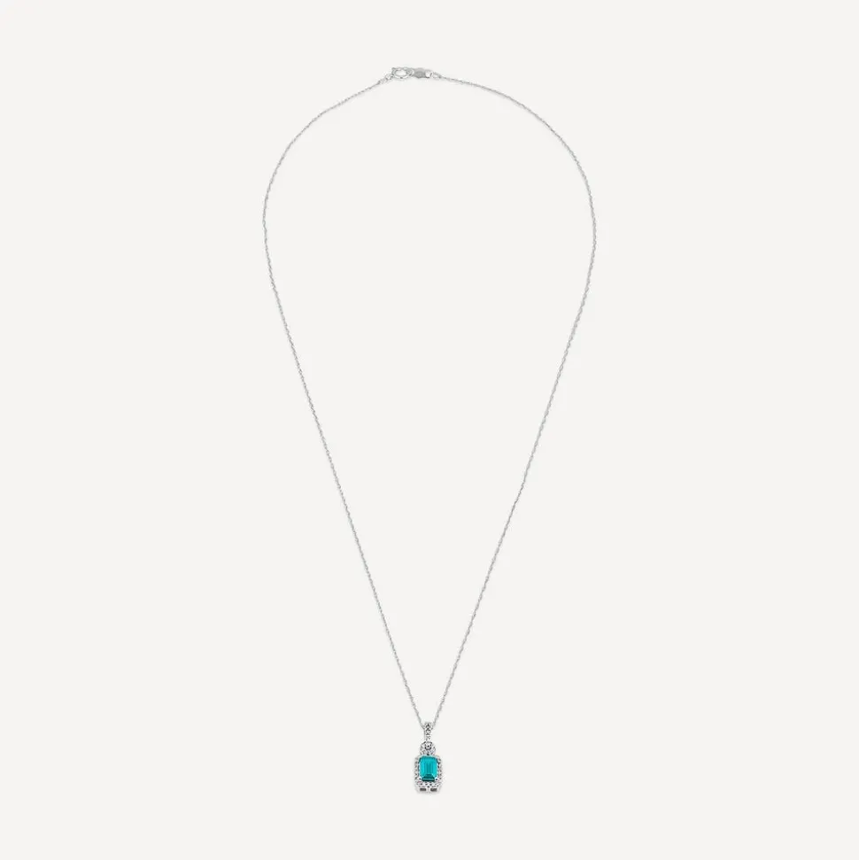 9ct White Gold Rectangular Blue Topaz & 0.10ct Diamond Halo Pendant