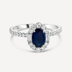 Platinum Sapphire Centre 0.48ct Diamond Halo Baguette & Shoulders Ring